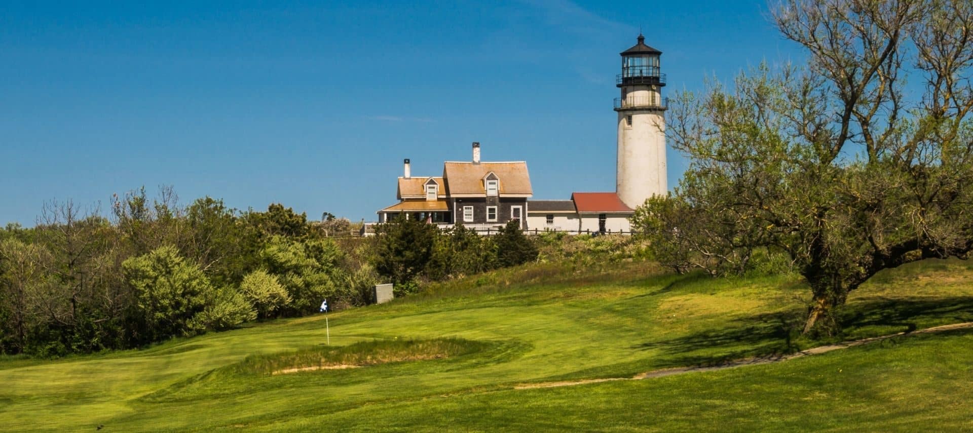 Golf course on Cape Cod with view of lighthouse