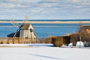 A windmill on the snow-covered coast on Cape Cod in the winter