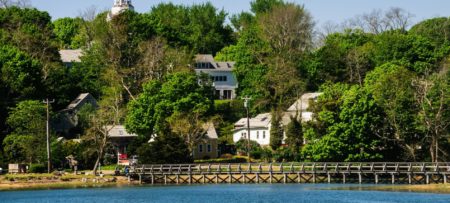 View of Wellfleet Bay's bridge and lush green landscaping