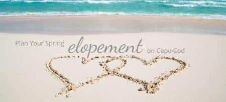 Two hearts drawn on a sandy beach with text “Plan Your Spring Elopement on Cape Cod”